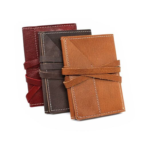 Leather Wrap Accessory Case in red, brown, and tan color options